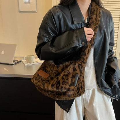 Leopard-print plush shoulder bag — dark brown worn over black jacket | BTendance