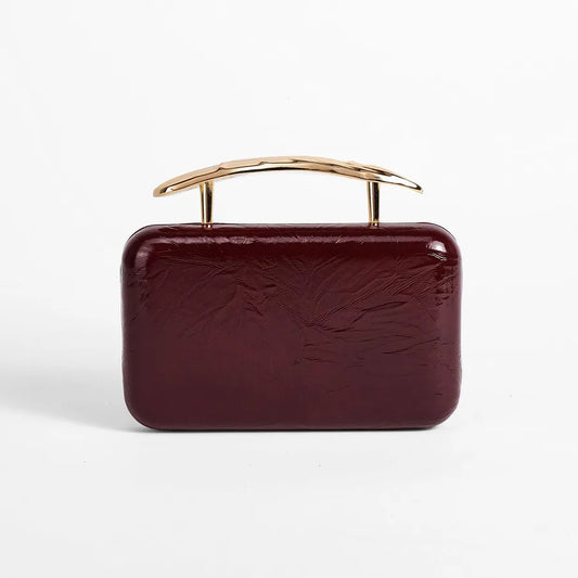 Textured rectangular evening bag with curved metal handle — burgundy front view | BTendance
