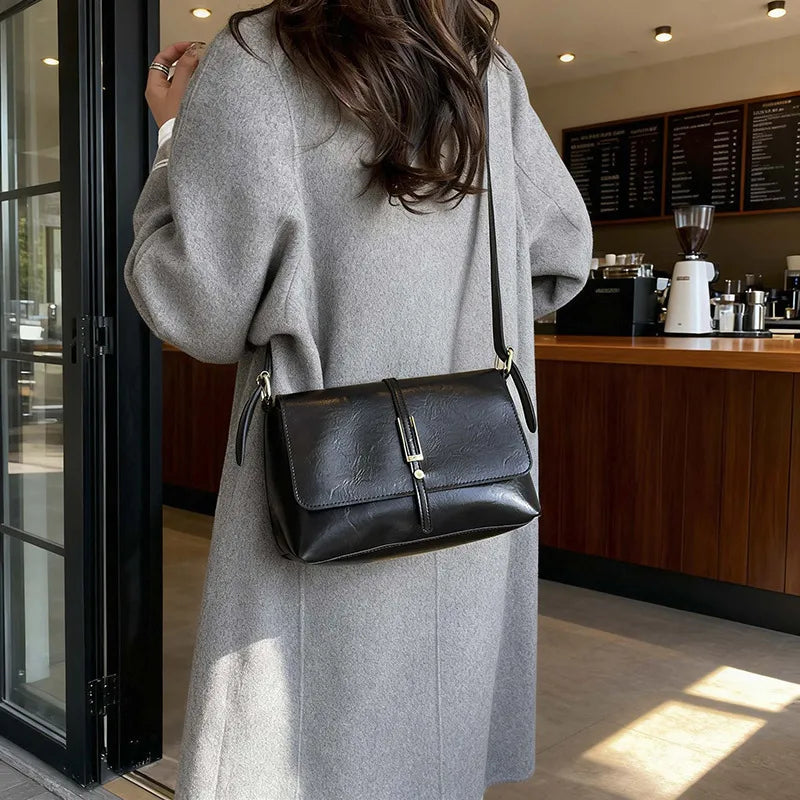 Rectangular flap shoulder bag with slim metal front detail — black worn crossbody | BTendance