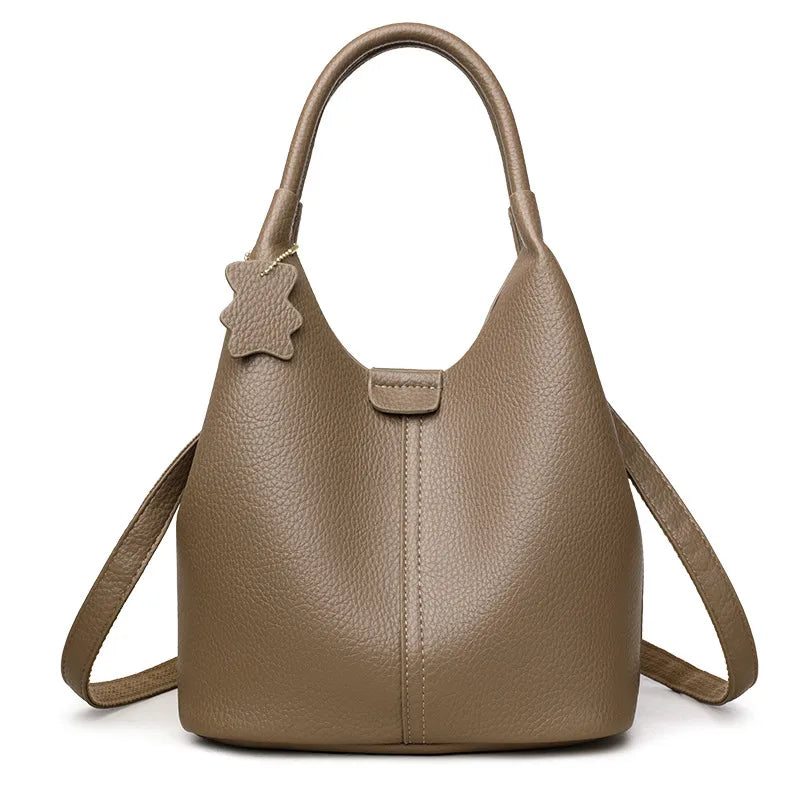 Bucket handbag with shoulder strap and bear charm – Taupe bag on white background | BTendance