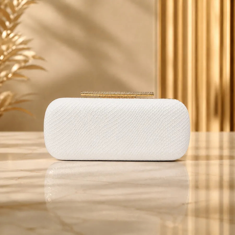 Snakeskin-texture rectangular evening clutch with bar clasp — white on marble table | BTendance