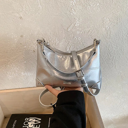 Glossy shoulder bag with strawberry charm – Silver bag, side angle in hand | BTendance