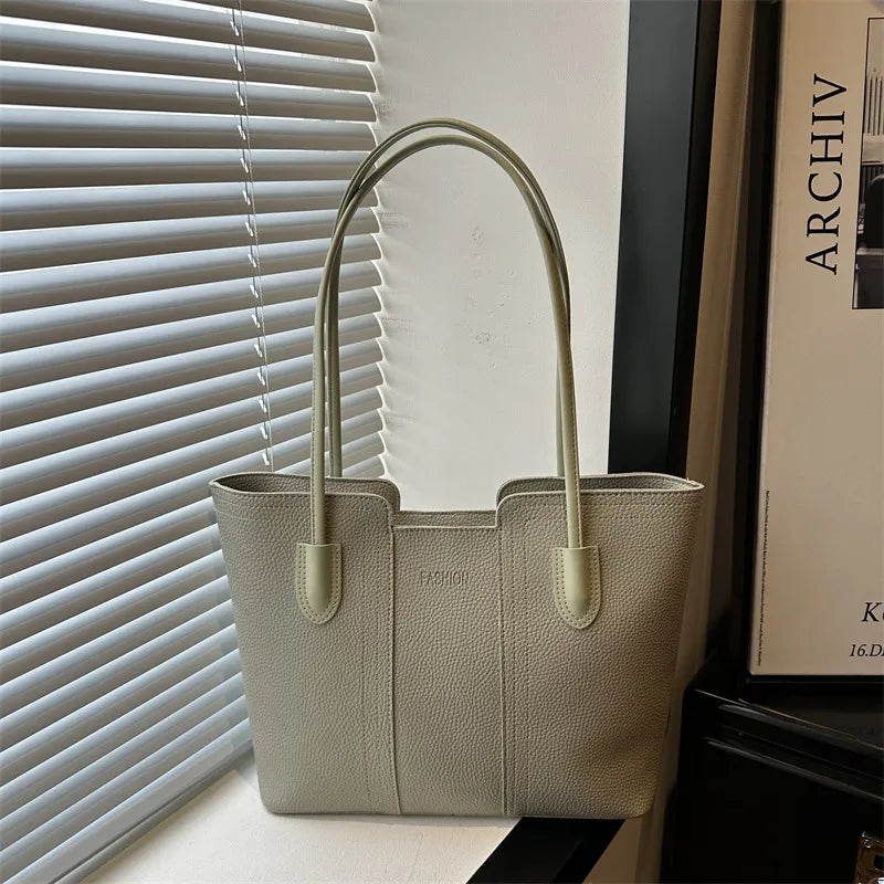Structured tote bag with long handles – Sage green bag beside a window | BTendance