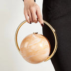 Marbled Globe Evening Bag with Orbit Handle – Light coffee carried by handle | BTendance