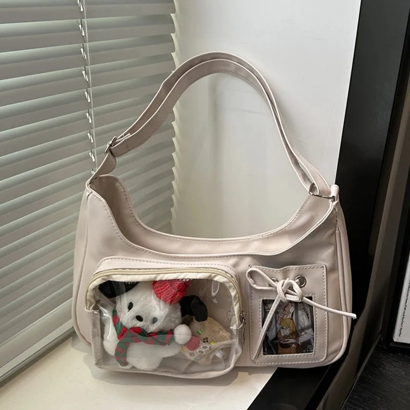 Shoulder bag with clear front display pocket — cream with plush decorations in clear pocket | BTendance