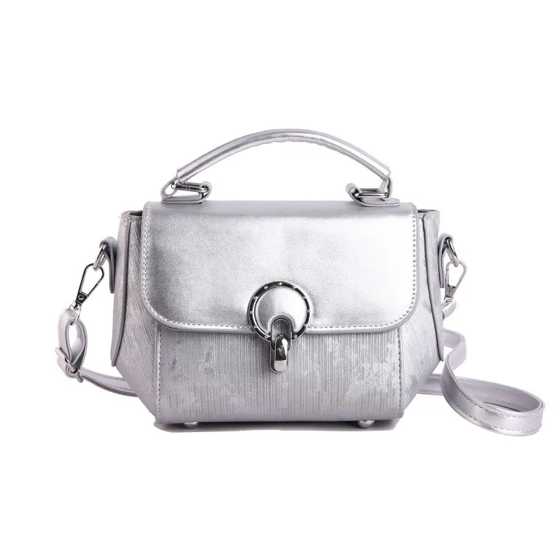 Ring clasp top handle crossbody bag – Silver bag with shoulder strap, front view | BTendance