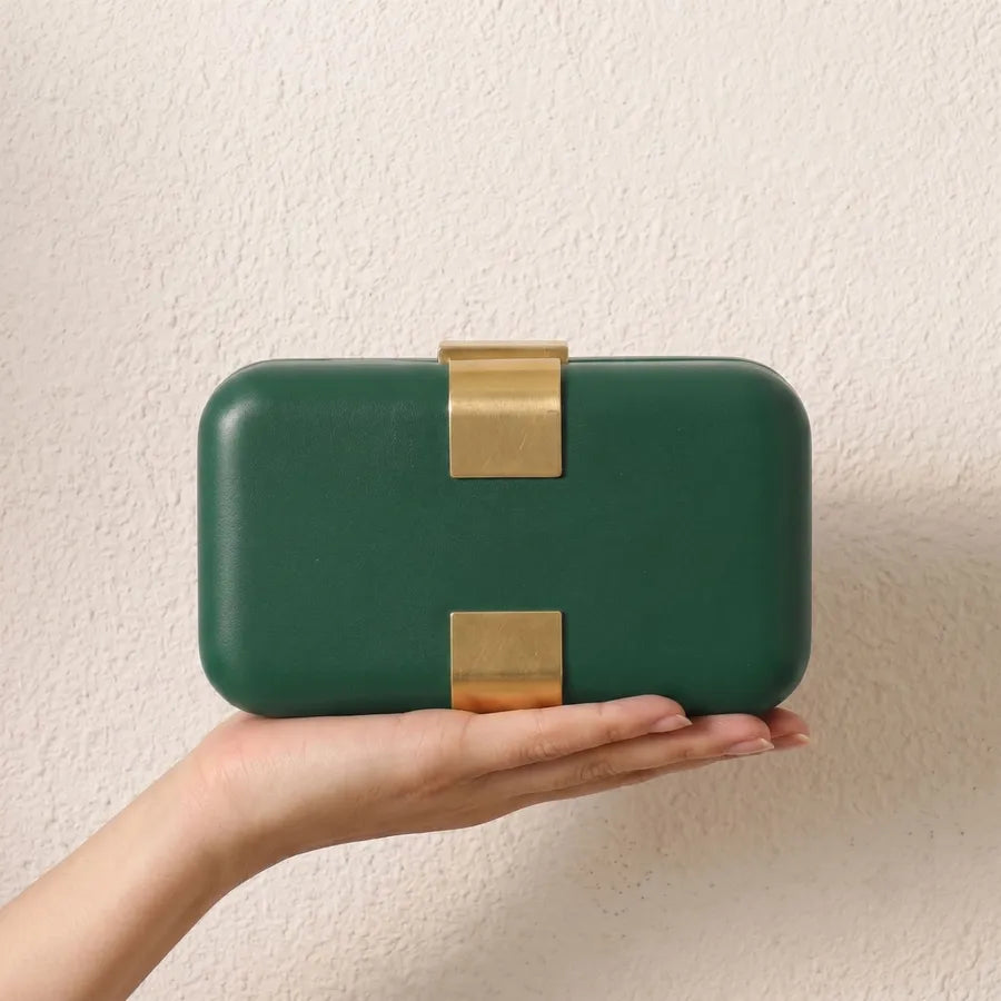 Rectangular evening clutch — green held in one hand | BTendance