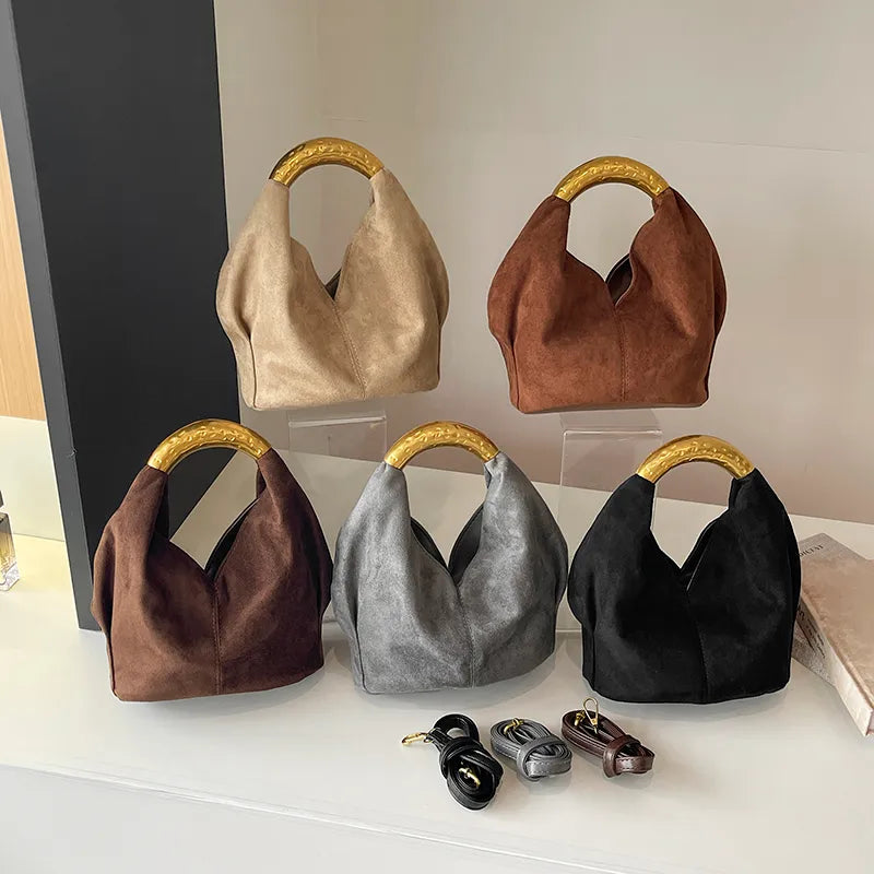 Suede-look bucket handbag with curved gold-tone handle — five colors arranged on display | BTendance