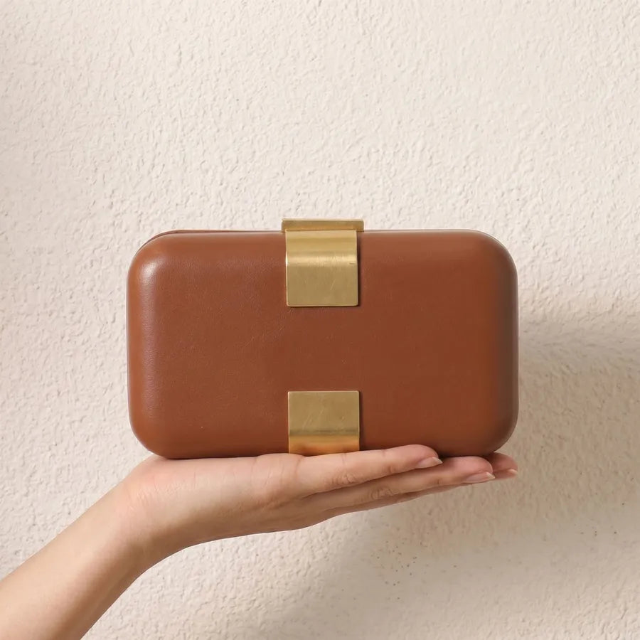 Rectangular evening clutch — brown held in one hand | BTendance