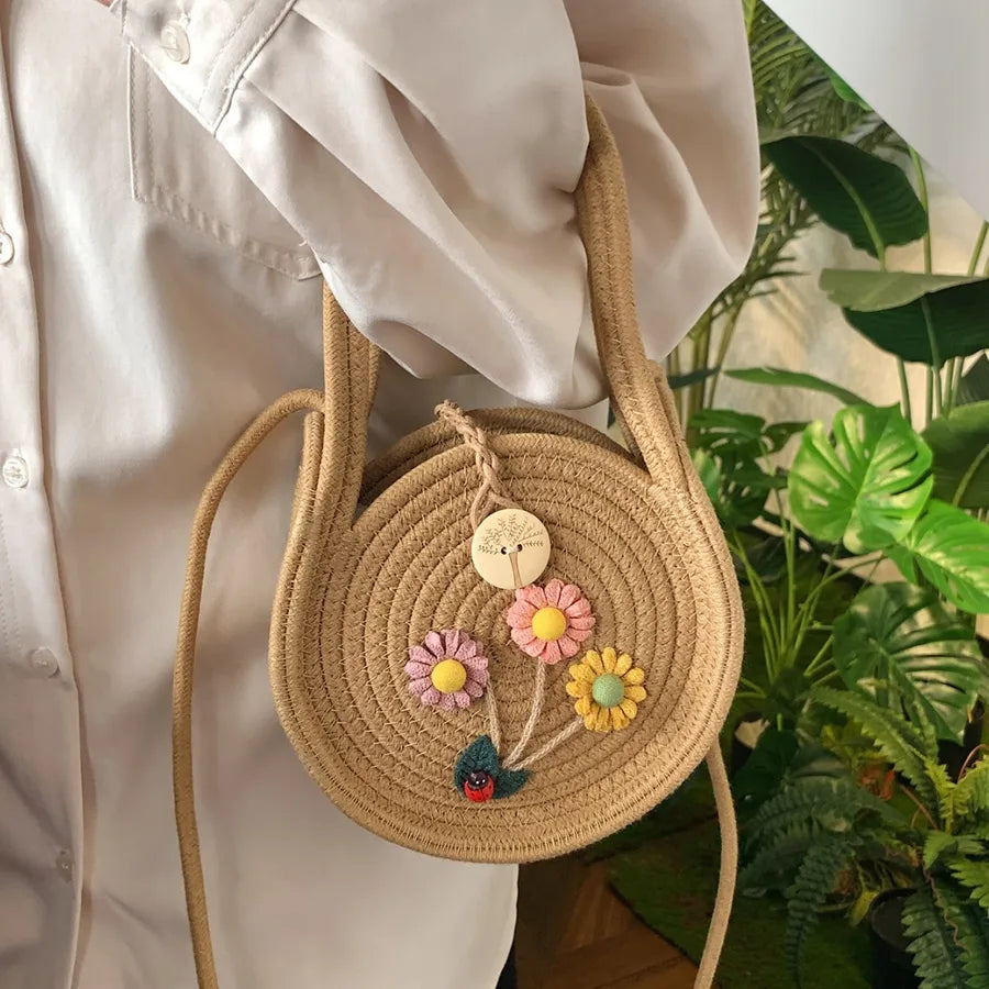 Round woven handbag with flower decoration – Tan flower bag carried at the side | BTendance