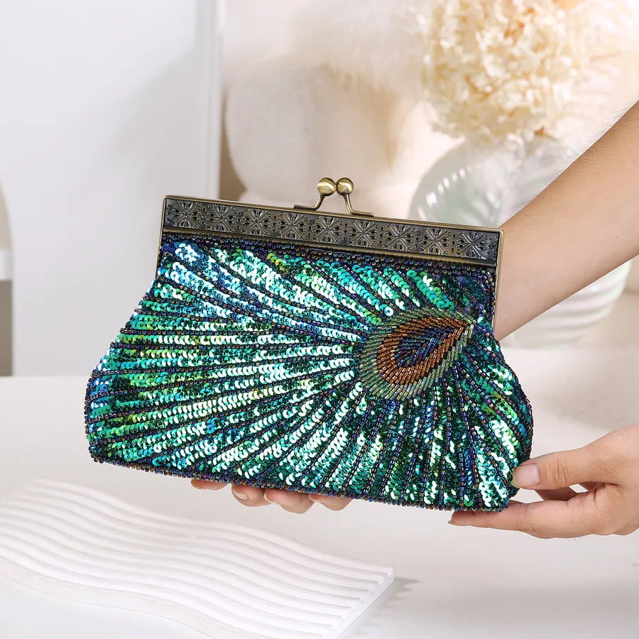 Women's Peacock Beaded Evening Clutch with Kiss Clasp – Front held for scale | BTendance