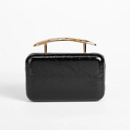 Textured rectangular evening bag with curved metal handle — black front view | BTendance