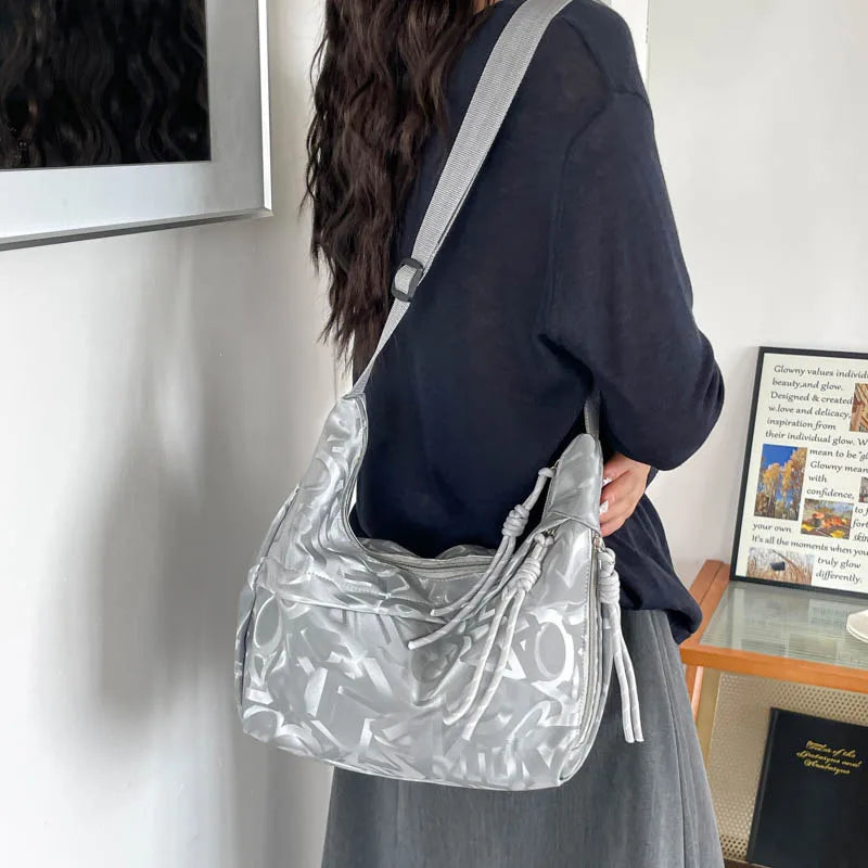 Patterned shoulder bag with braided front detail — silver worn on shoulder | BTendance