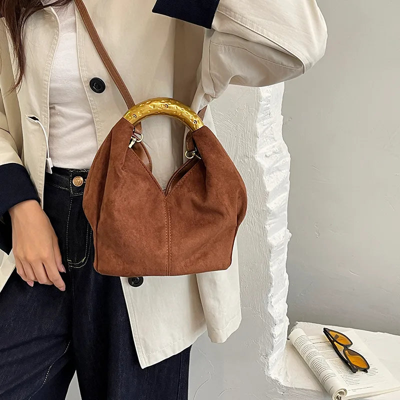Suede-look bucket handbag with curved gold-tone handle — rust worn crossbody | BTendance