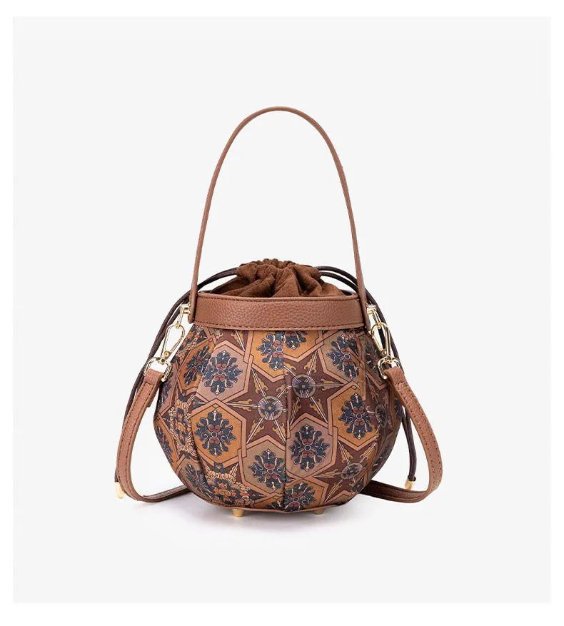 Embroidered drawstring bucket bag – Tan patterned bag, front view | BTendance