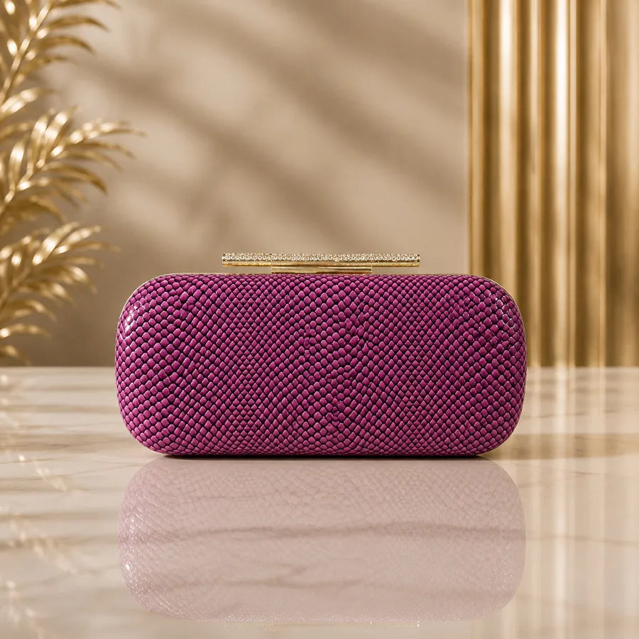 Snakeskin-texture rectangular evening clutch with bar clasp — purple on marble table | BTendance