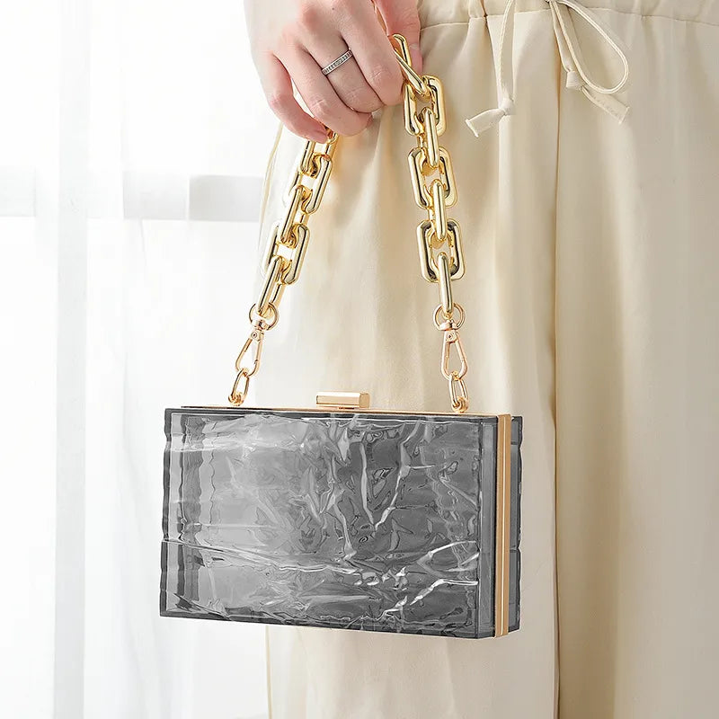 Transparent box bag with gold tone chain – Smoke grey bag held by its chain | BTendance