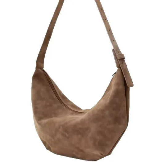 Crescent-shaped shoulder bag with adjustable strap — brown on white background | BTendance