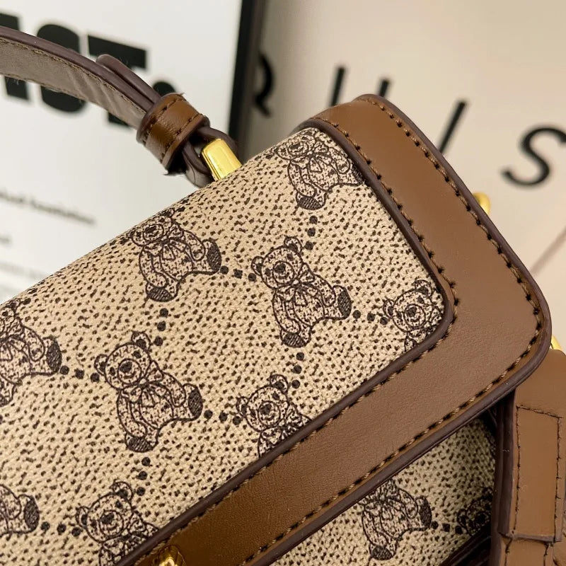 Bear pattern top handle bag with charm – Close view of bear pattern and stitching | BTendance
