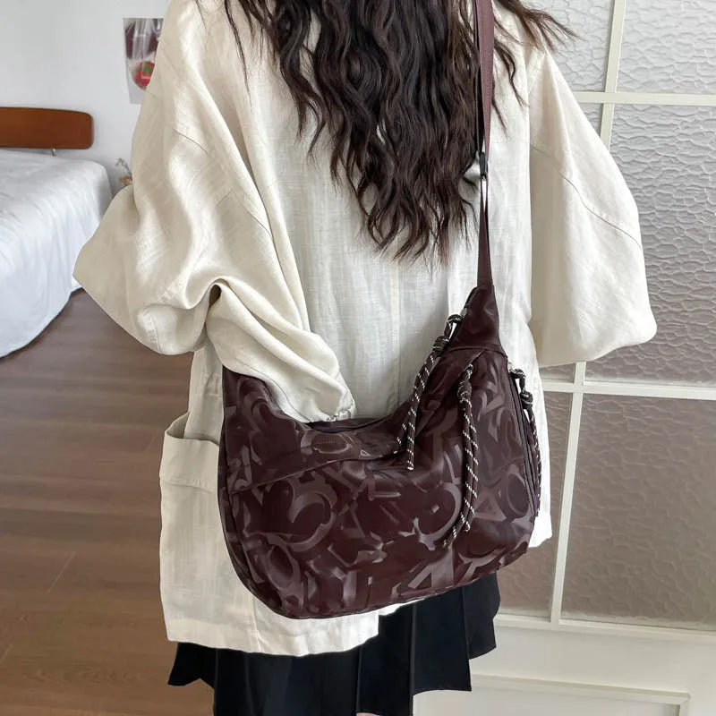 Patterned shoulder bag with braided front detail — brown worn on shoulder | BTendance