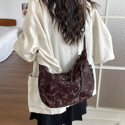 Patterned shoulder bag with braided front detail — brown worn on shoulder | BTendance