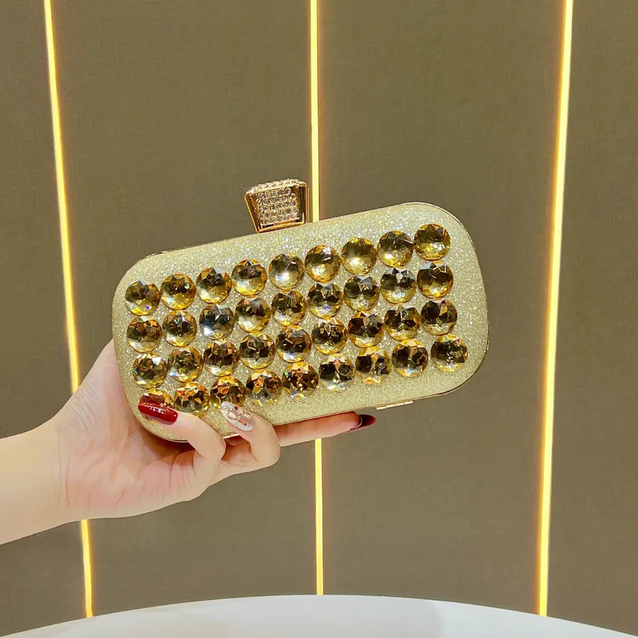 Women's Faceted Rhinestone Evening Clutch with Chain – Gold held for scale | BTendance