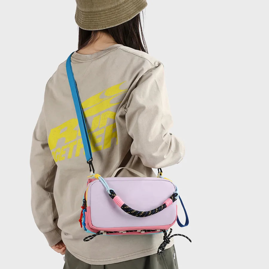 Color-block crossbody bag with rope handle — pink worn crossbody from rear | BTendance