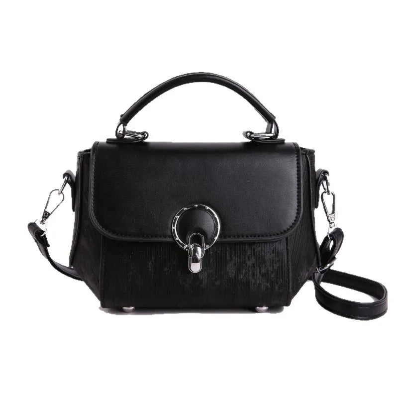 Ring clasp top handle crossbody bag – Black bag on white background | BTendance