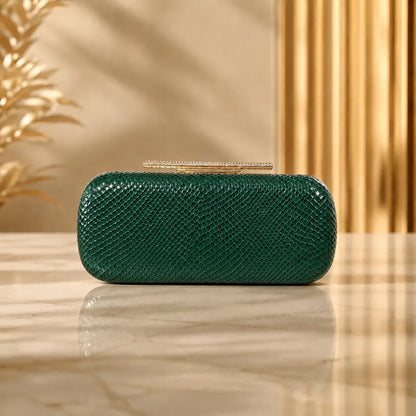 Snakeskin-texture rectangular evening clutch with bar clasp — green on marble table | BTendance