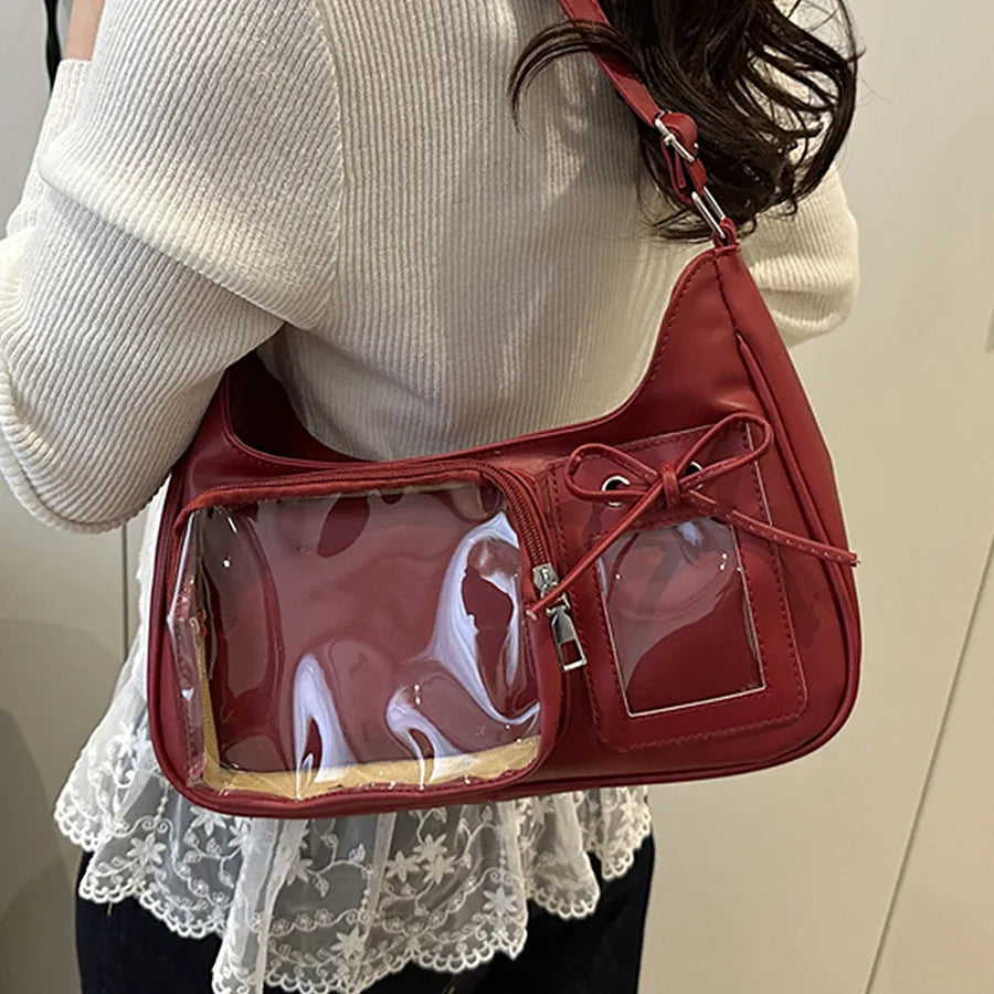 Shoulder bag with clear front display pocket — burgundy worn on shoulder with empty clear pocket | BTendance