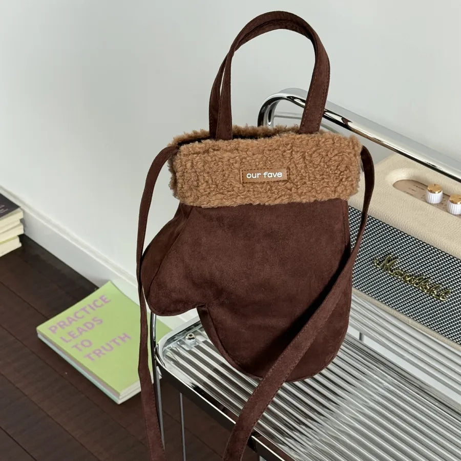 Mitten-shaped crossbody bag with contrasting plush panel — brown with tan cuff held by handle | BTendance