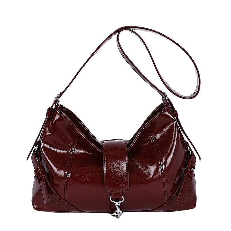 Glossy shoulder bag with central strap and metal clip — burgundy on white background | BTendance
