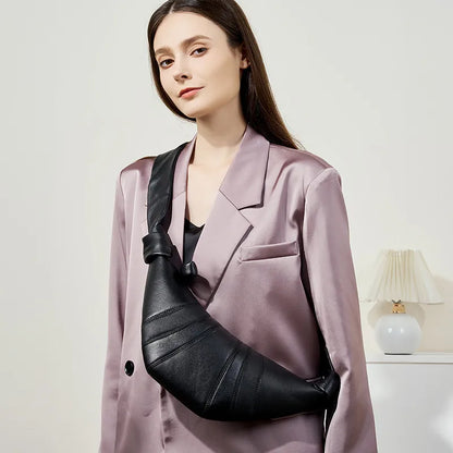 Panelled crescent sling bag – Black bag worn with a mauve blazer | BTendance