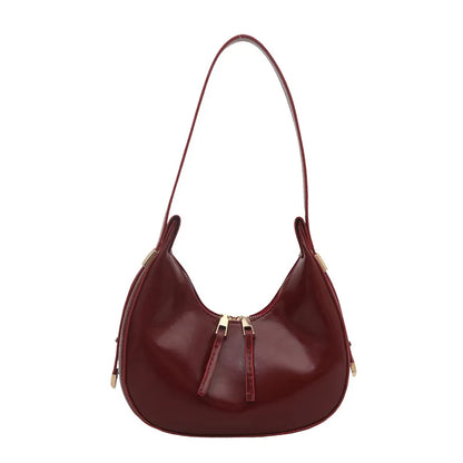 Curved zip shoulder bag – Burgundy bag on white background | BTendance
