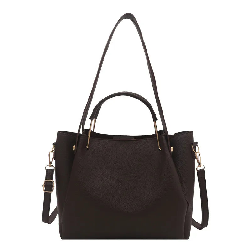 Textured bucket handbag with contrasting dark handles — dark brown with long strap on white background | BTendance