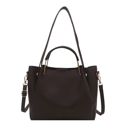 Textured bucket handbag with contrasting dark handles — dark brown with long strap on white background | BTendance
