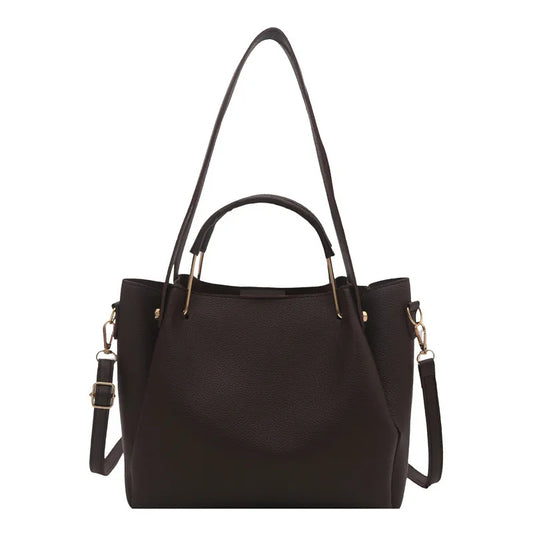 Textured bucket handbag with contrasting dark handles — dark brown with long strap on white background | BTendance