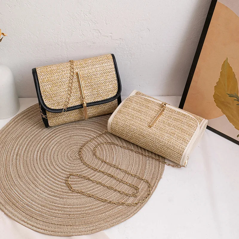 Woven flap crossbody bag with chain strap – Black and cream trim bags on a round mat | BTendance