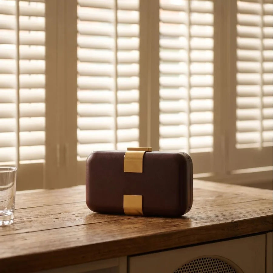 Rectangular evening clutch — brown front view on wooden cabinet | BTendance