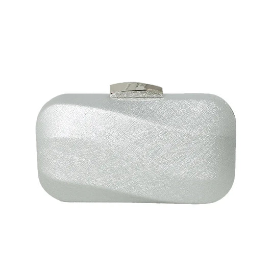 Rounded rectangular evening clutch with metal clasp — silver front view on white background | BTendance