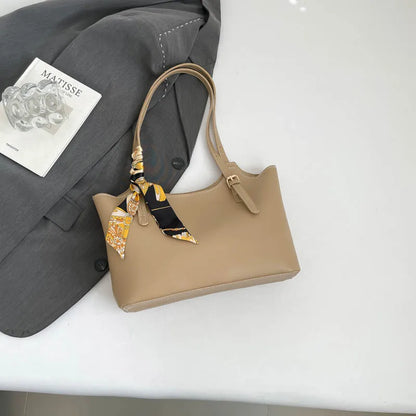 Shoulder tote bag with patterned scarf – Beige bag arranged beside a blazer | BTendance