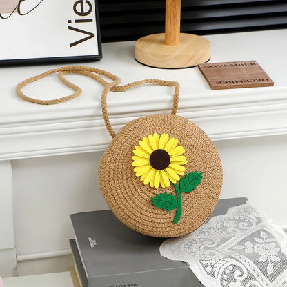 Round woven sunflower crossbody bag – Brown stem and leaf sunflower bag on a display table | BTendance
