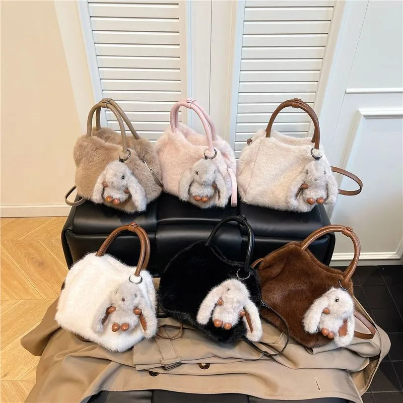 Plush top-handle handbag with rabbit charm — six colors arranged on display | BTendance