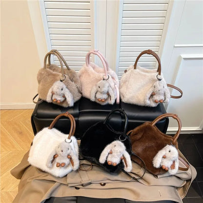 Plush top-handle handbag with rabbit charm — six colors arranged on display | BTendance