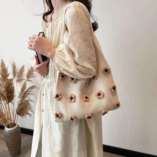 Flower applique knit shoulder tote – Brown flower tote worn on the shoulder | BTendance