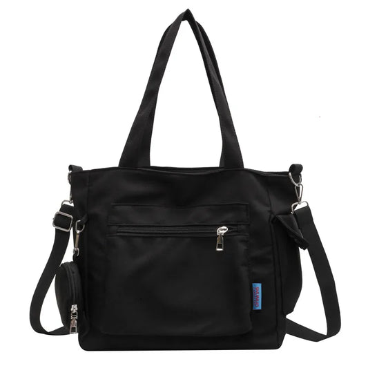 Pocket tote bag with round pouch – Black bag on white background | BTendance
