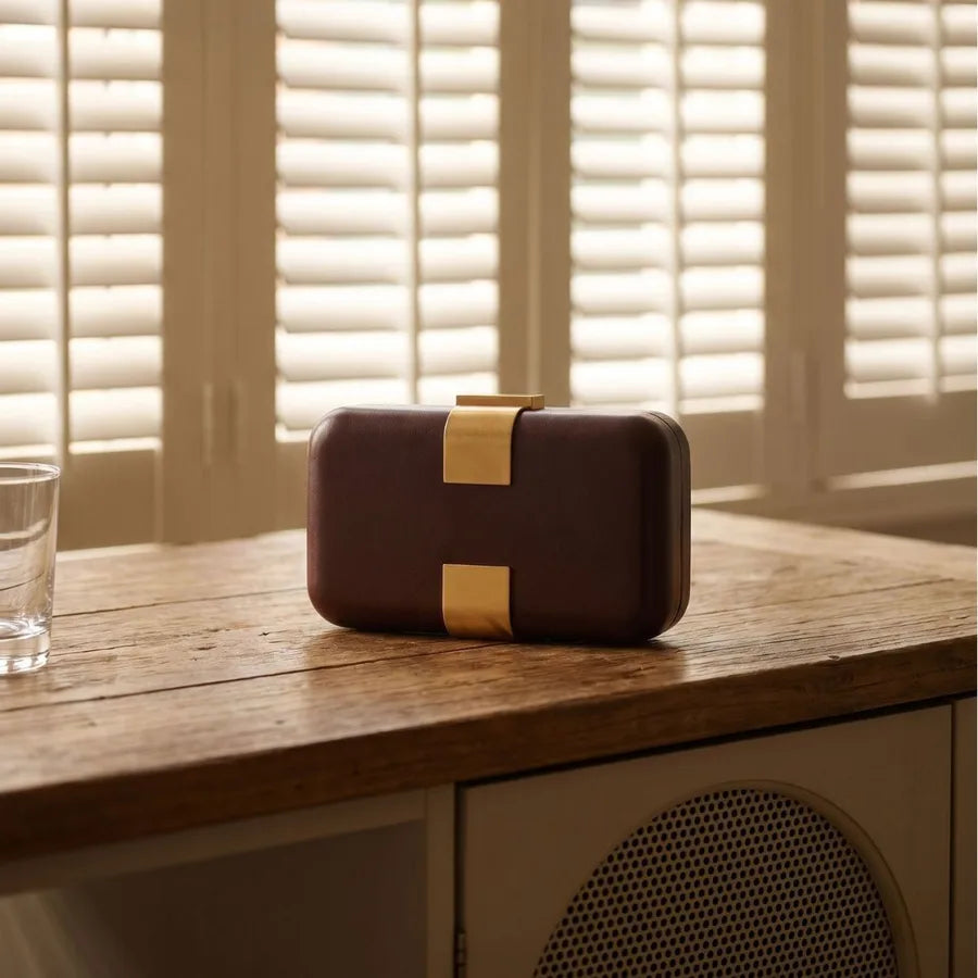 Rectangular evening clutch — brown front view on wooden cabinet | BTendance