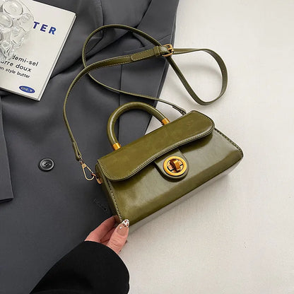 Structured top-handle flap handbag with round gold-tone clasp — green with extended shoulder strap | BTendance