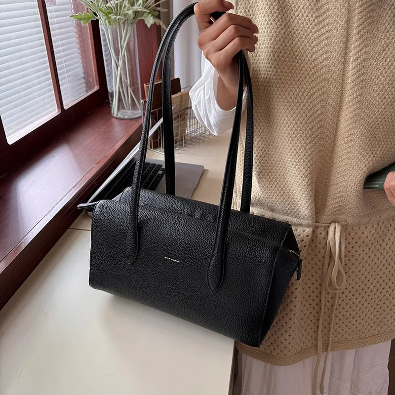Rectangular shoulder bag with long twin handles — black held by handles | BTendance