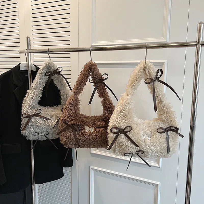 Shaggy plush shoulder bag with ribbon bows — grey brown and cream hanging together | BTendance